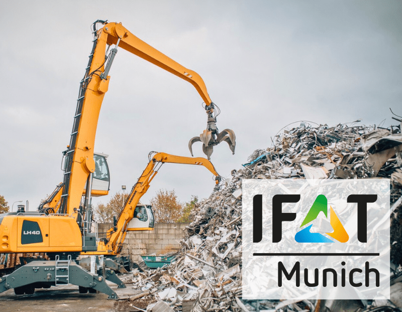 Excavator loading scrap at IFAT Munich, presented by PFREUNDT, experts in mobile weighing systems.