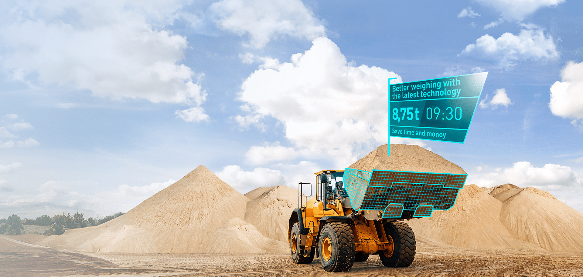 Wheel loaders fitted with a PFREUNDT weighing system and digital display on sand mounds under a blue sky.