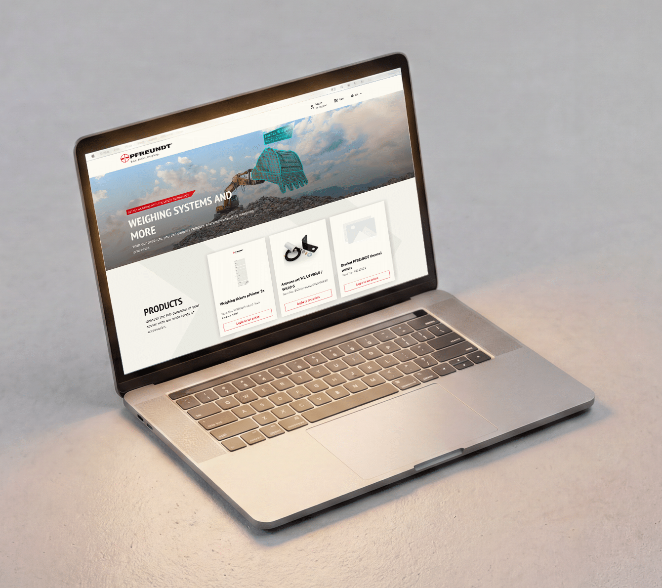 A laptop with the PFREUNDT website open shows mobile weighing systems such as excavator scales, belt scales and more.